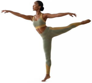 Professional dancer holding a balanced movement pose displaying ideal flexibility and muscle alignment